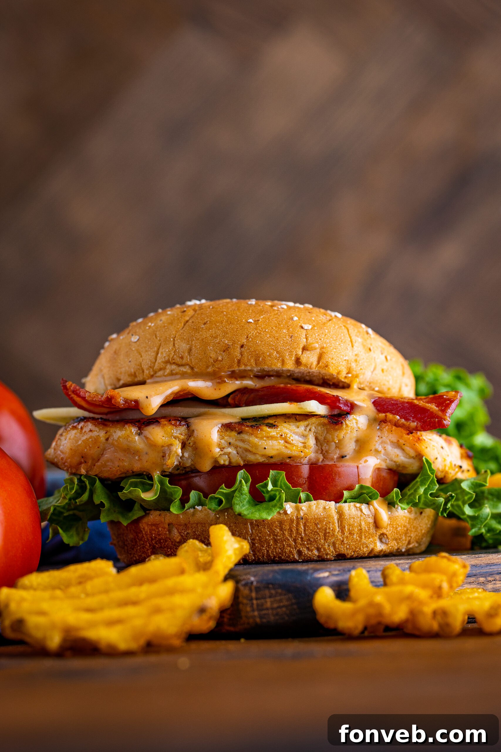 Close-up of a Chick-fil-A style grilled chicken sandwich, showcasing the texture of the grilled chicken.