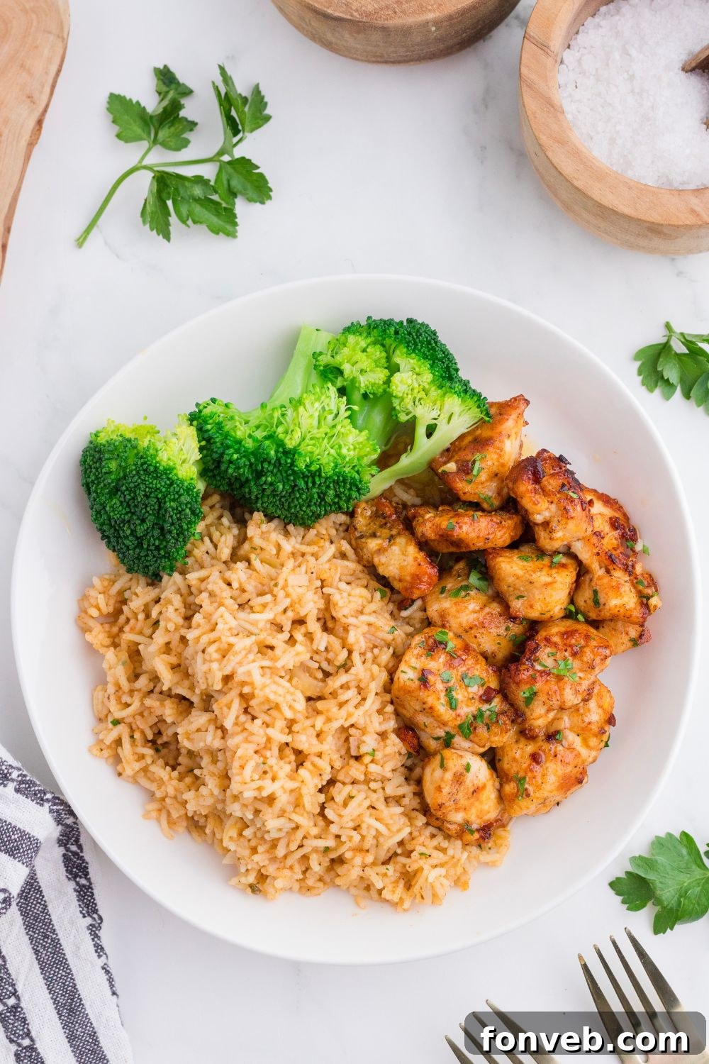 overhead look of plate with Garlic Butter Chicken Bites on it with salt and pepper to the side