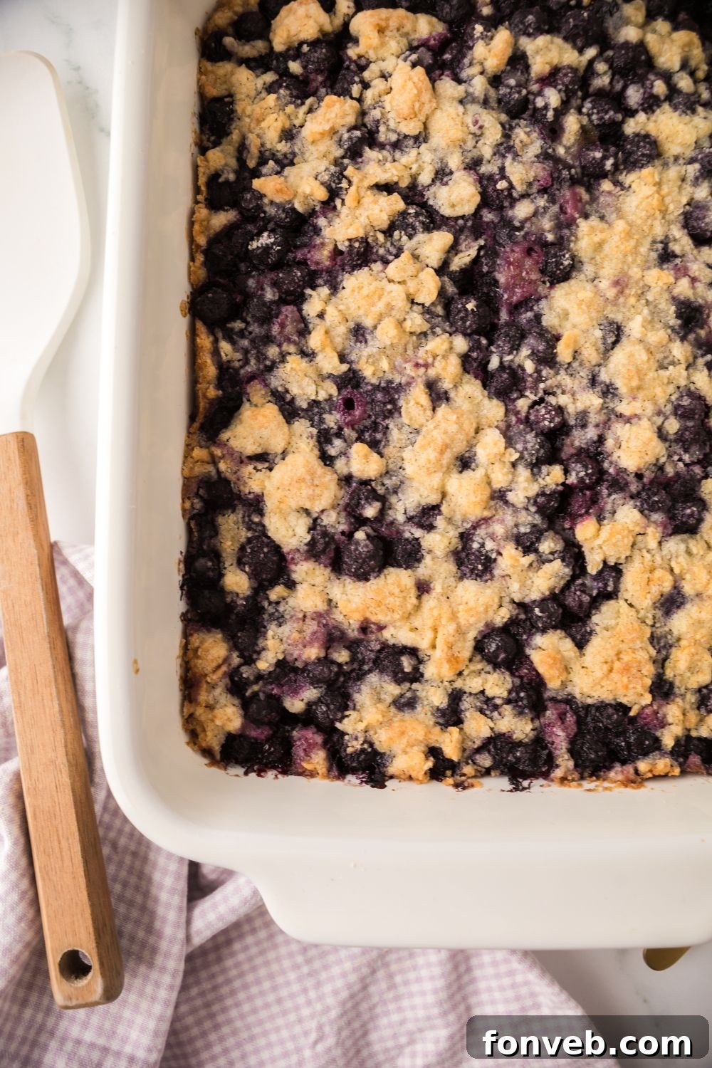Blueberry Crumb Bars in a casserole dish on table 