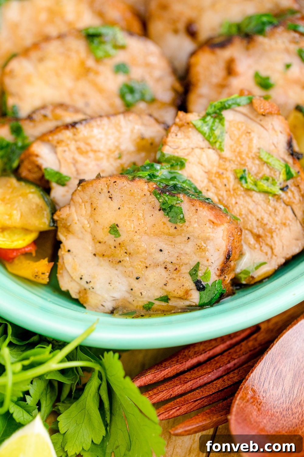 close up of sliced pork tenderloin on table 
