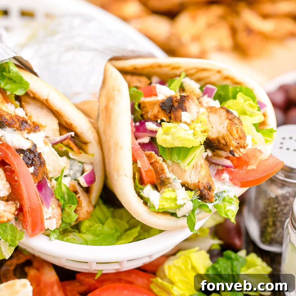 Chicken Gyros are in a platter with more ingredients around them 
