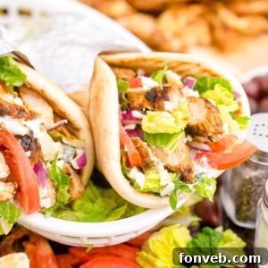 Chicken Gyros are in a platter with more ingredients around them