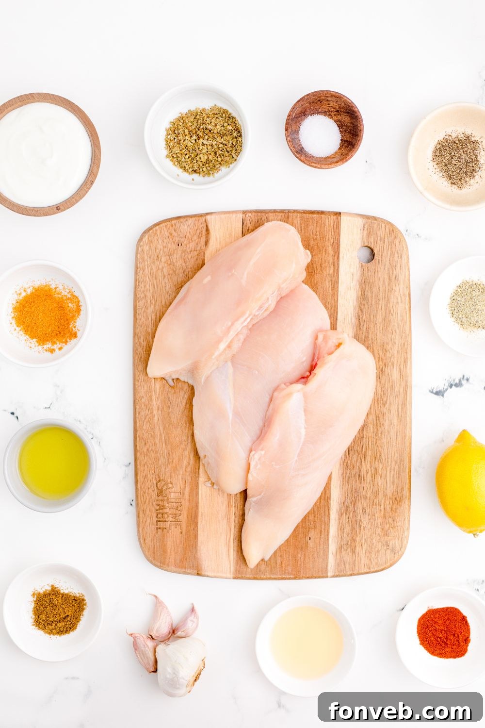 ingredients for chicken gyros on table in single serve bowls 