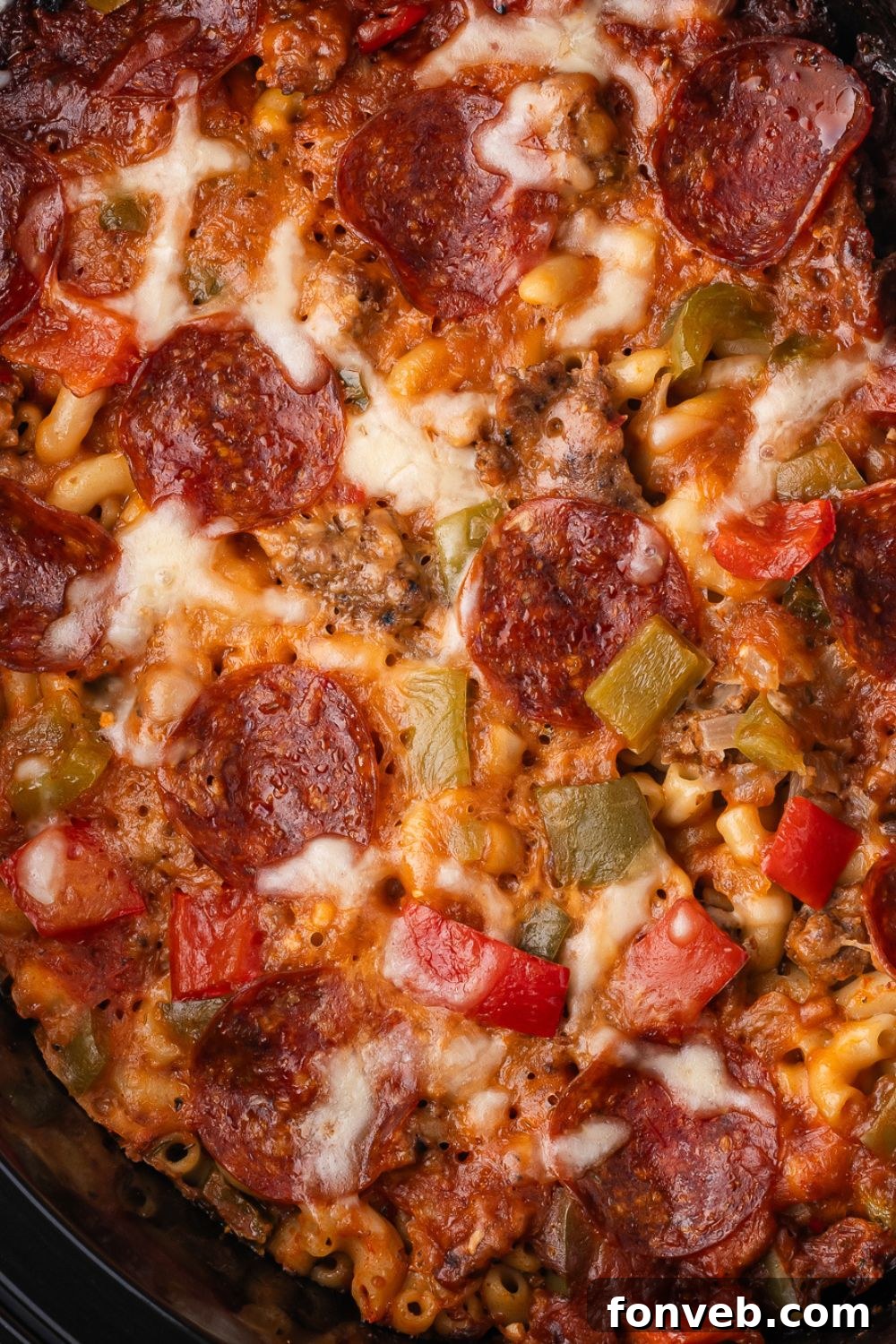 pizza casserole in a slow cooker for a close up view of the mixture