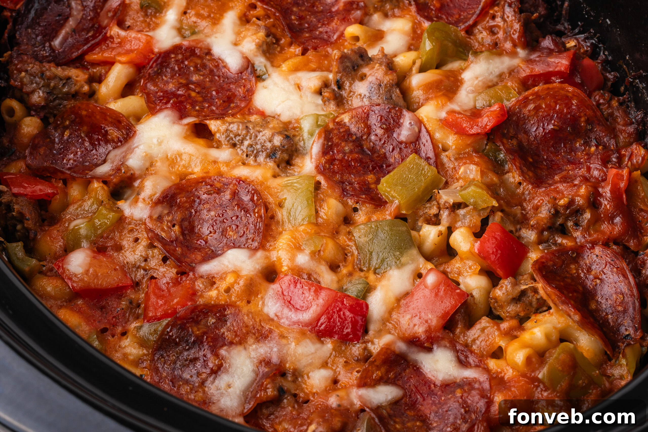 Slow Cooker Pizza Casserole up close showing the toppings