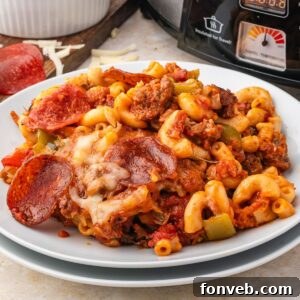 Pizza Casserole on a plate with slow cooker behind it