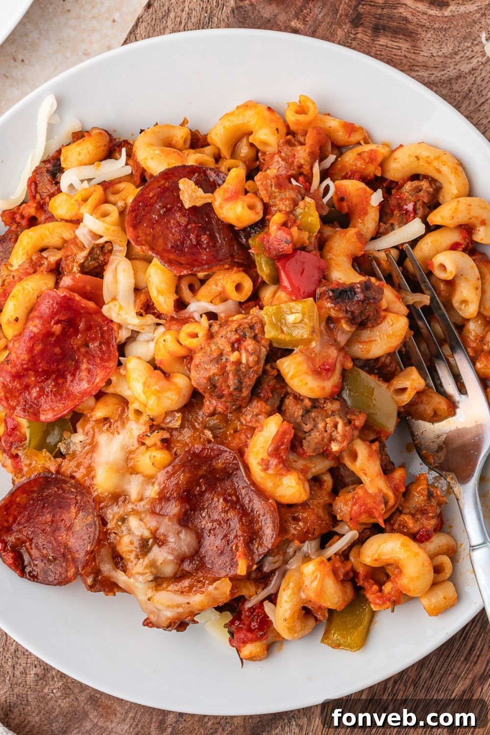 plate with pizza casserole on it, and a fork to side of plate