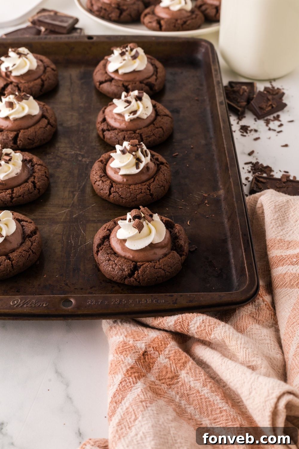 A festive cookie tray adorned with Chocolate Pie Cookies, elegantly presented with a side of delicate chocolate shavings, ready for holiday enjoyment.