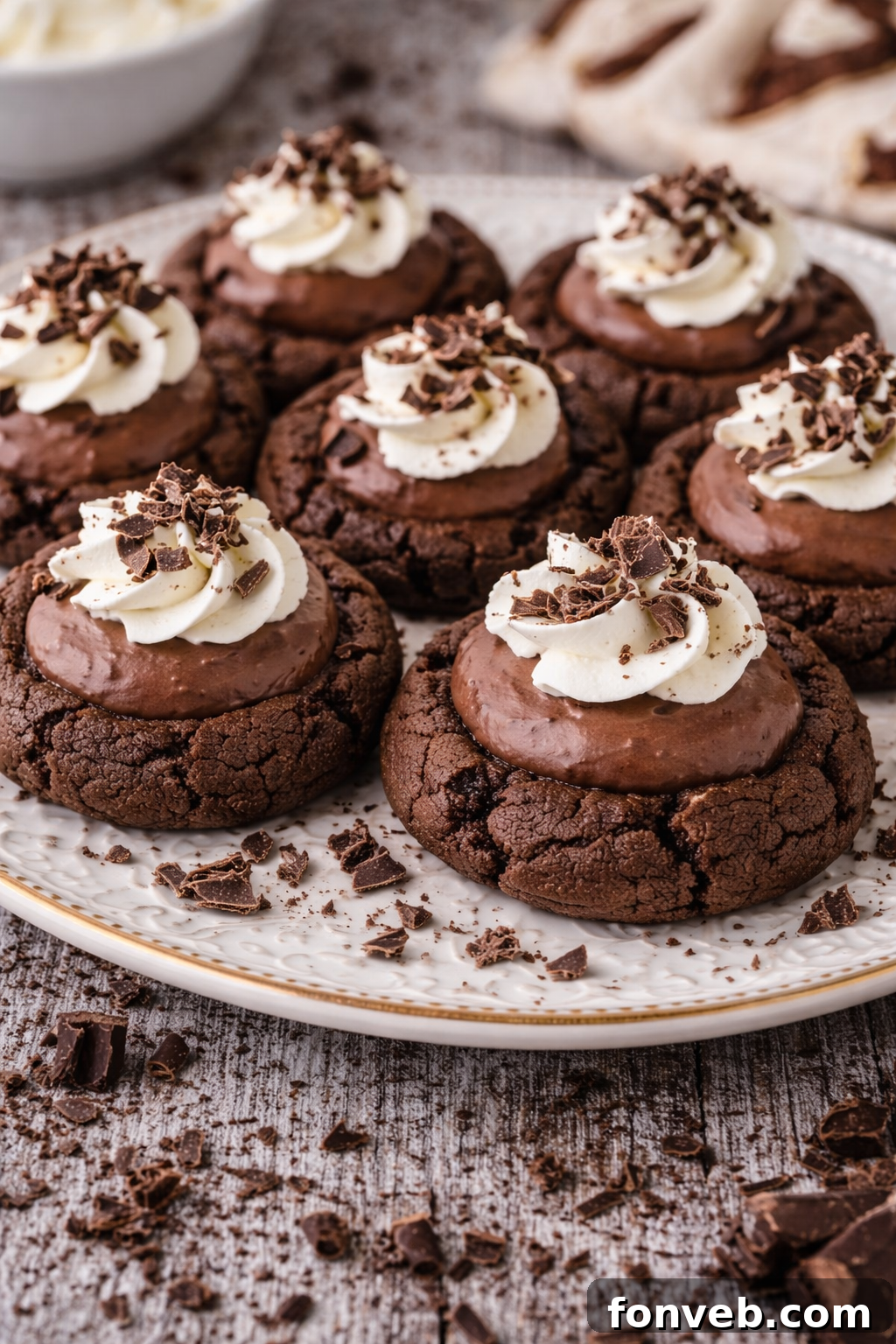 Close-up of a single Chocolate Pie Cookie on a white plate, lavishly topped with fluffy whipped cream and delicate chocolate shavings, ready for enjoyment.