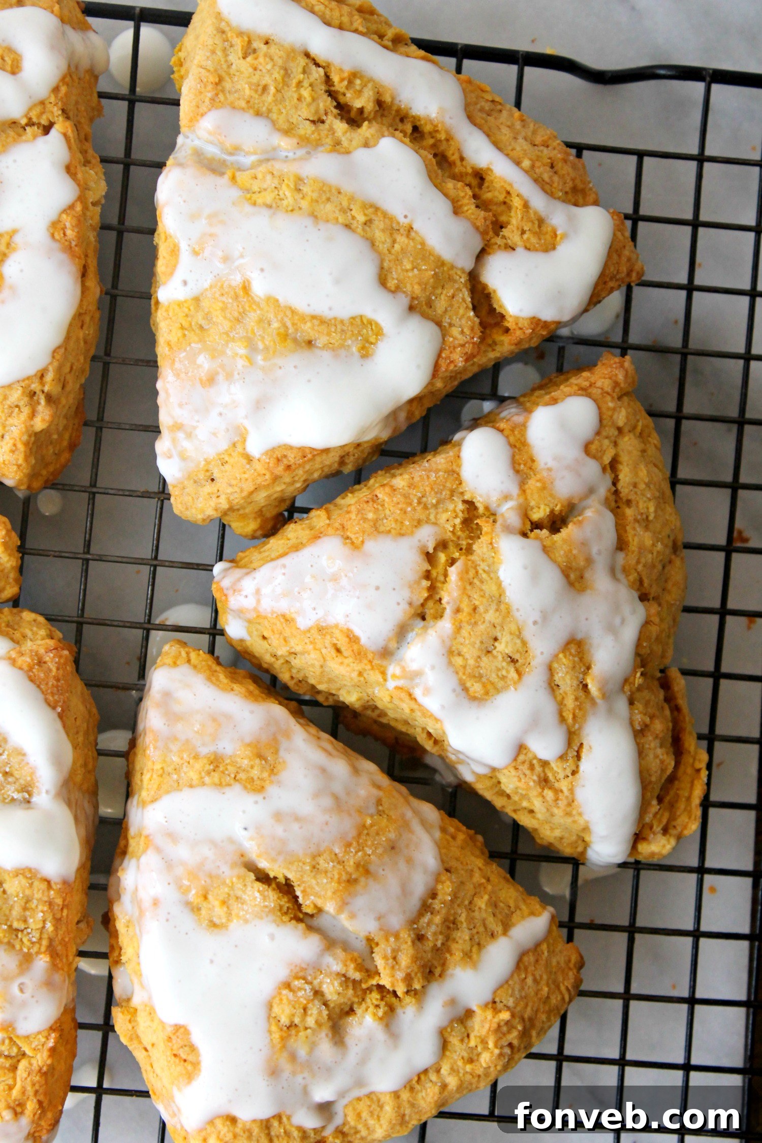 An inviting display of finished pumpkin scones, perfect for fall breakfasts or desserts.
