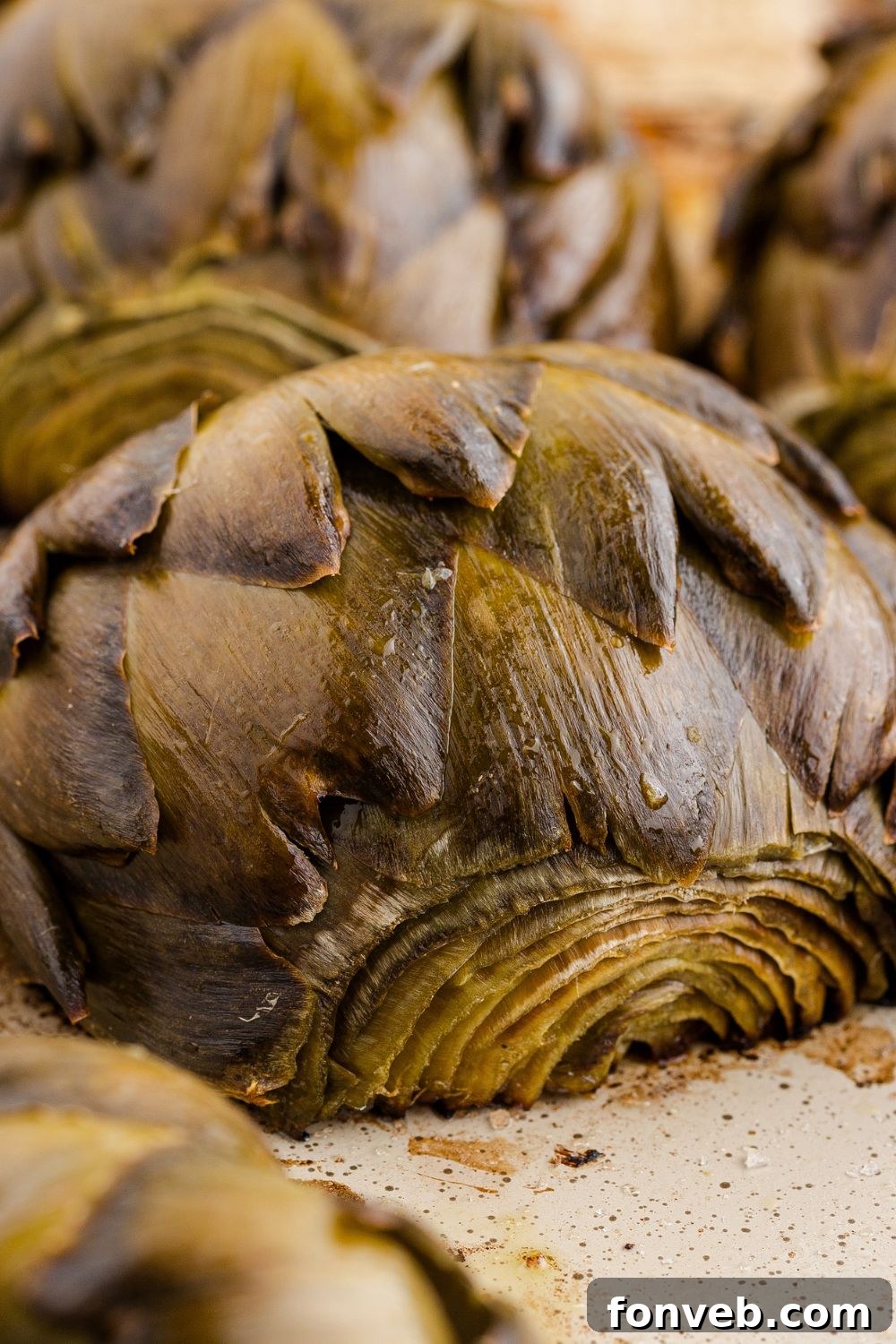 baked artichokes on tray all baked up