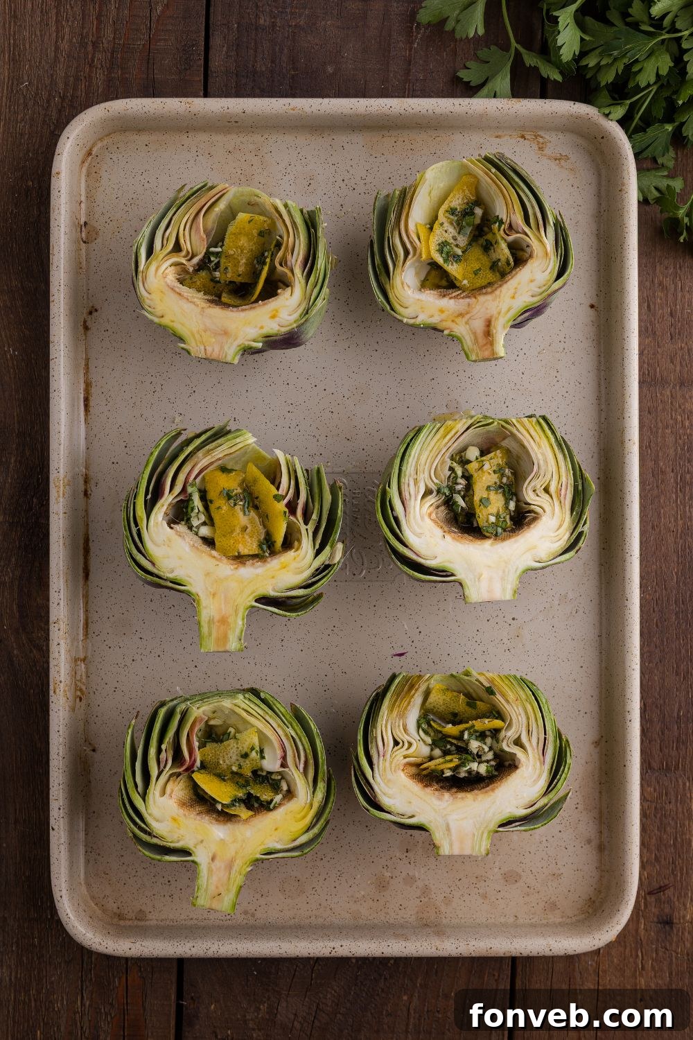 seasoned artichokes on baking tray