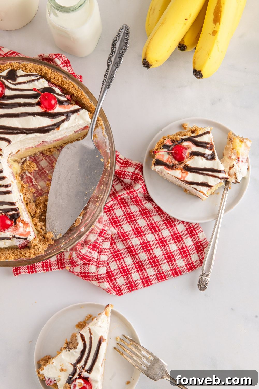 Several slices of No Bake Banana Split Pie beautifully arranged on individual plates on a table, inviting guests to indulge.