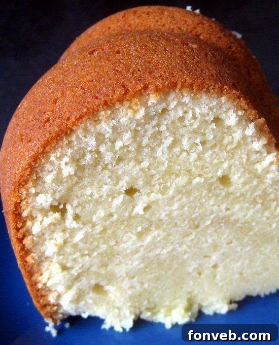 A beautifully baked Cream Cheese Pound Cake, golden brown and inviting