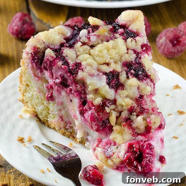 Raspberry Cream Cheese Coffee Cake, showing beautiful swirls of cream cheese and raspberries
