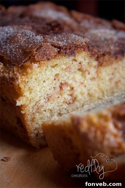 Freshly baked Amish Cinnamon Bread, perfectly golden with visible cinnamon swirls