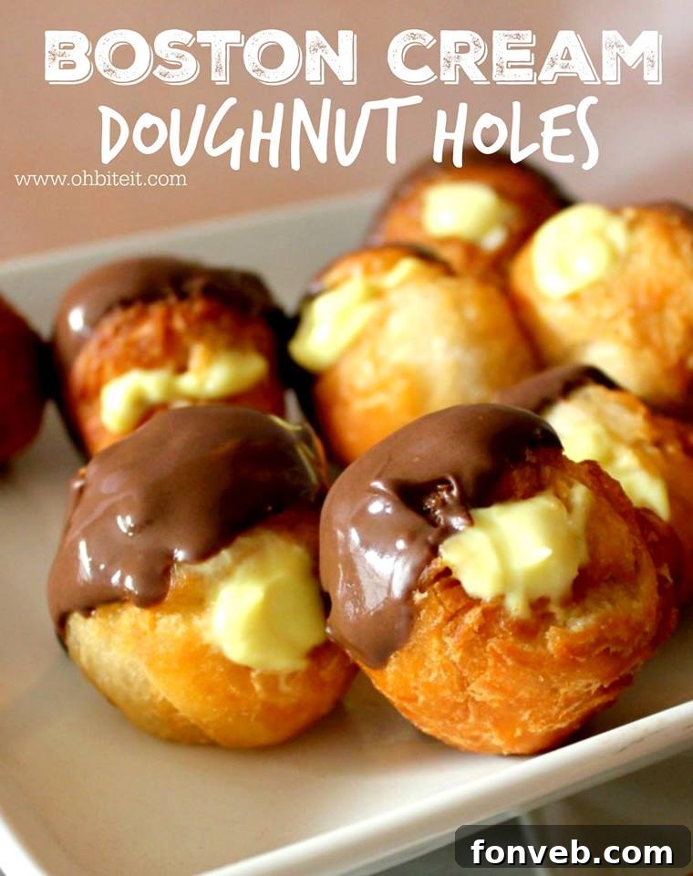 Boston Cream Doughnut Holes, glossy with chocolate glaze and ready to eat