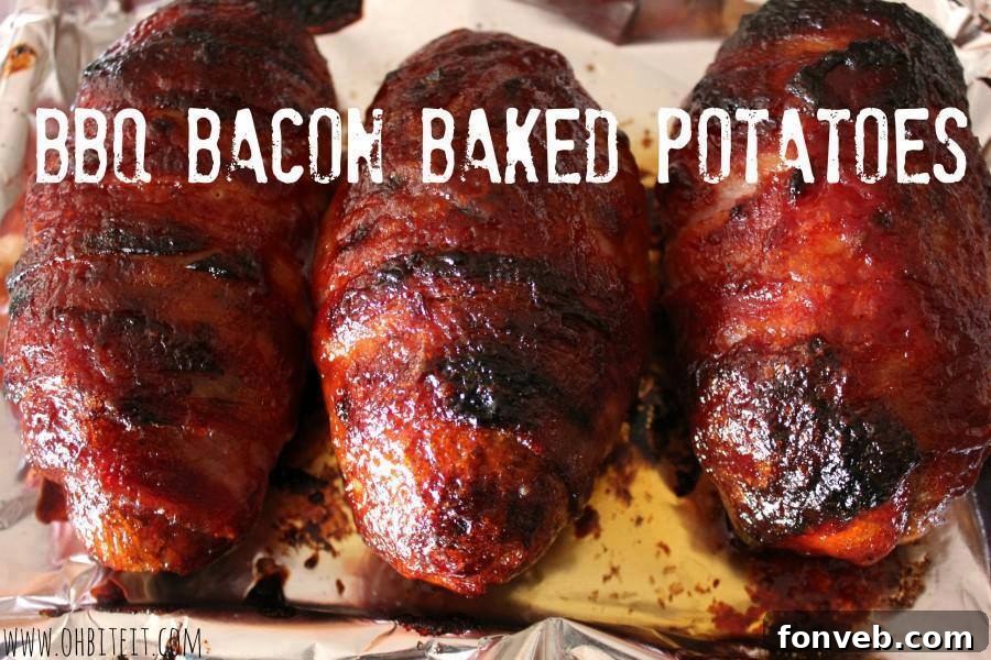 Loaded BBQ Bacon Baked Potatoes with cheese, chives, and BBQ sauce drizzle