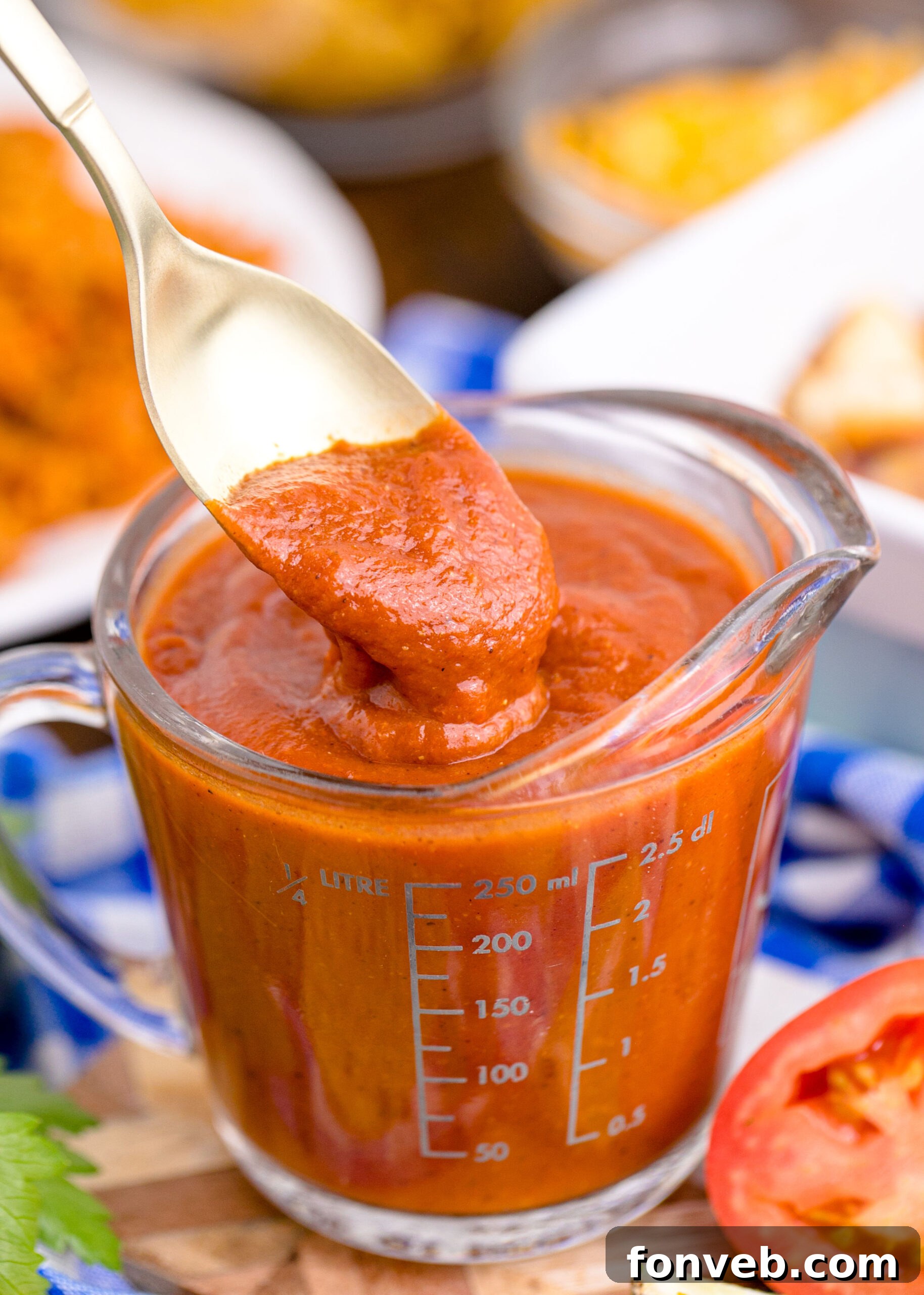 spoon with Homemade Enchilada Sauce on it 