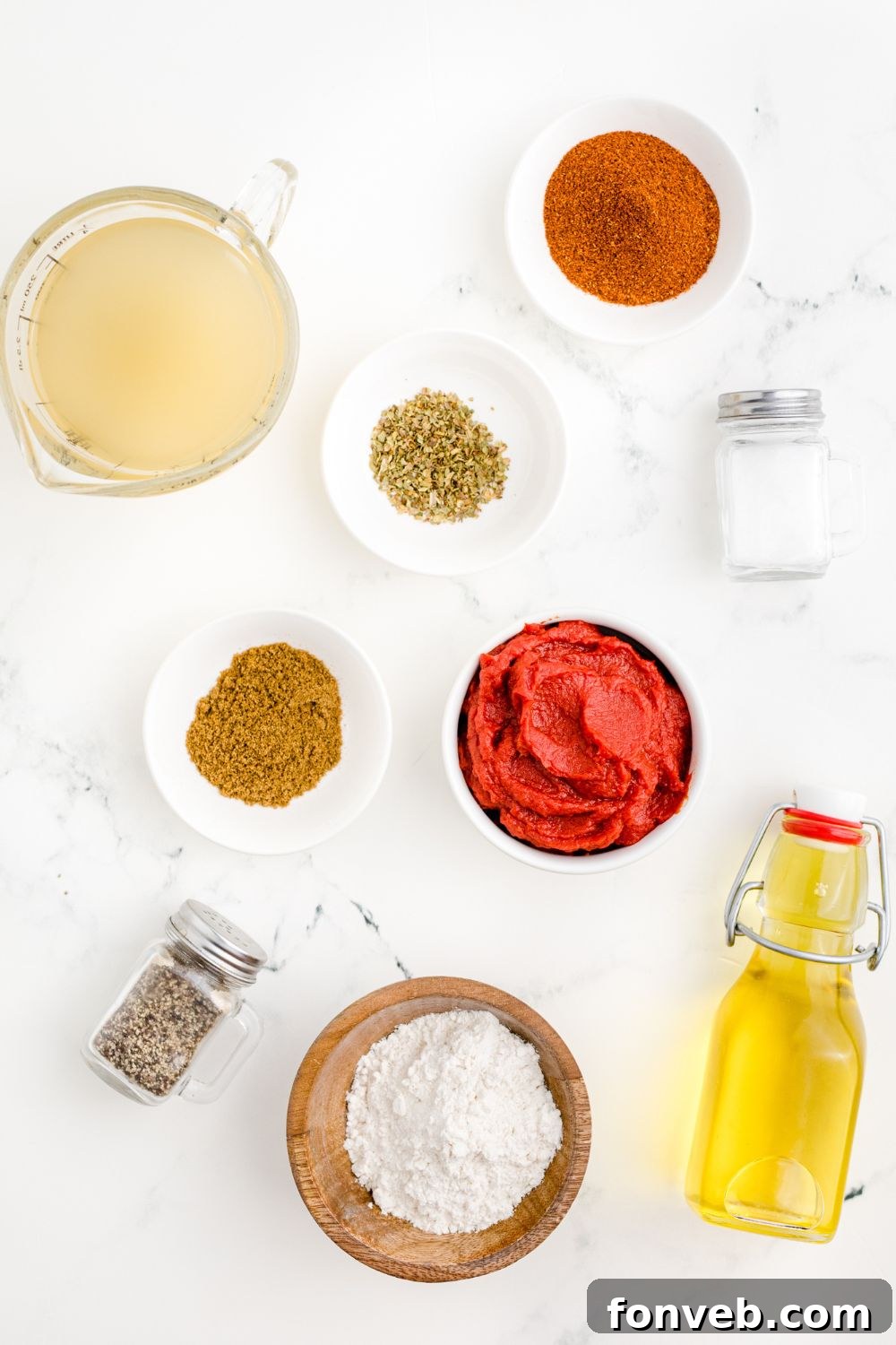 ingredients for Homemade Enchilada Sauce in single serve bowls on table 