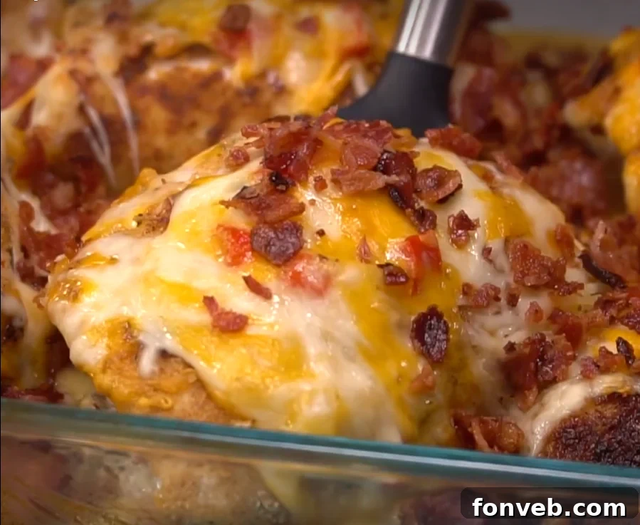 Close-up of Four Cheese Bacon Stuffed Smothered Chicken Casserole with melted cheese
