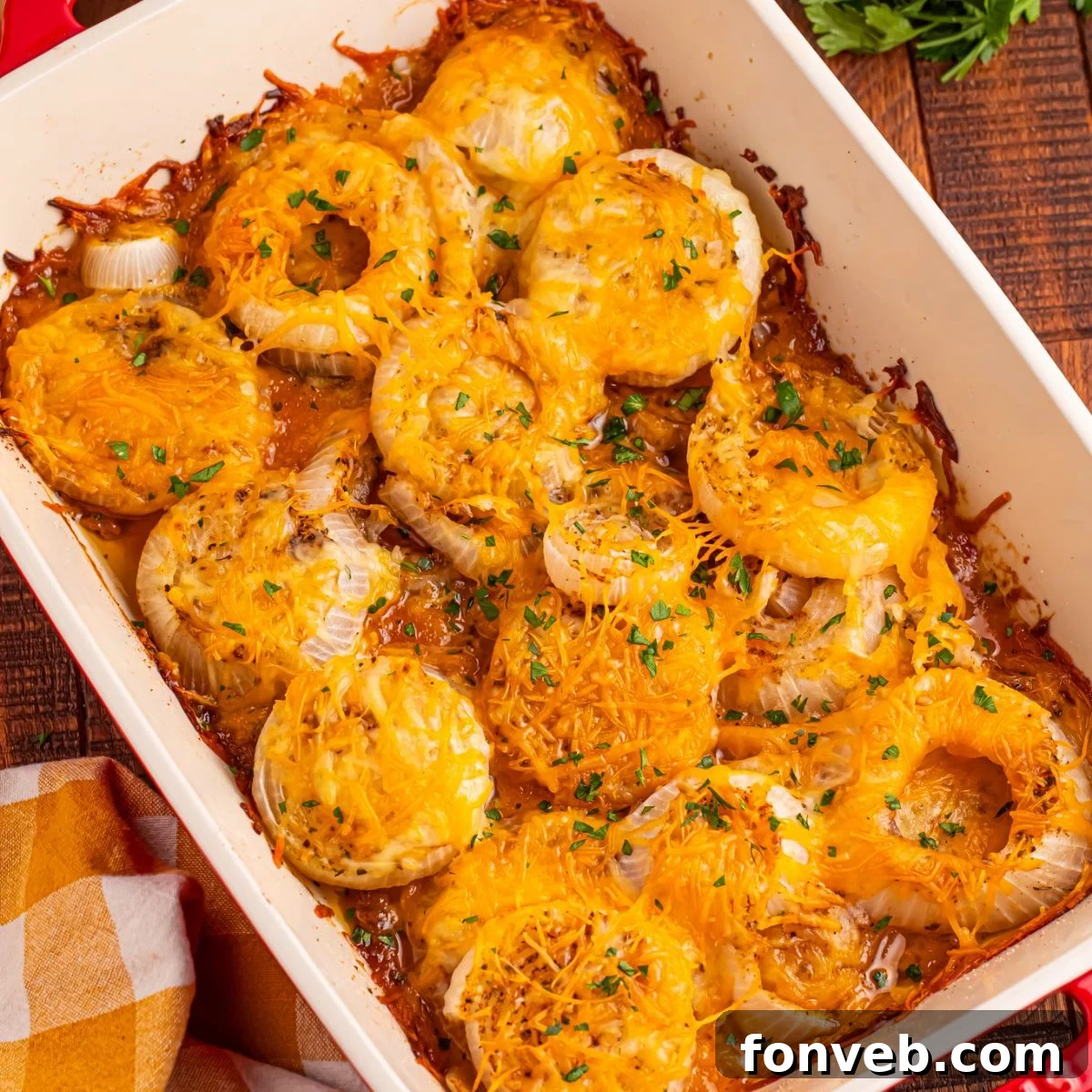 Cheesy Tennessee Onions on a casserole pan on wooden table 