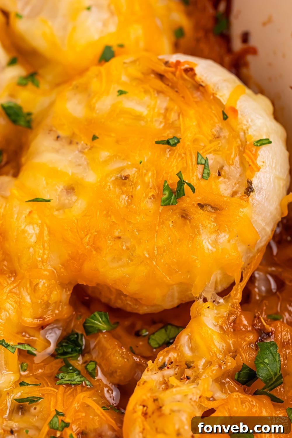 Cheesy Tennessee Onions on table with some parsley on top