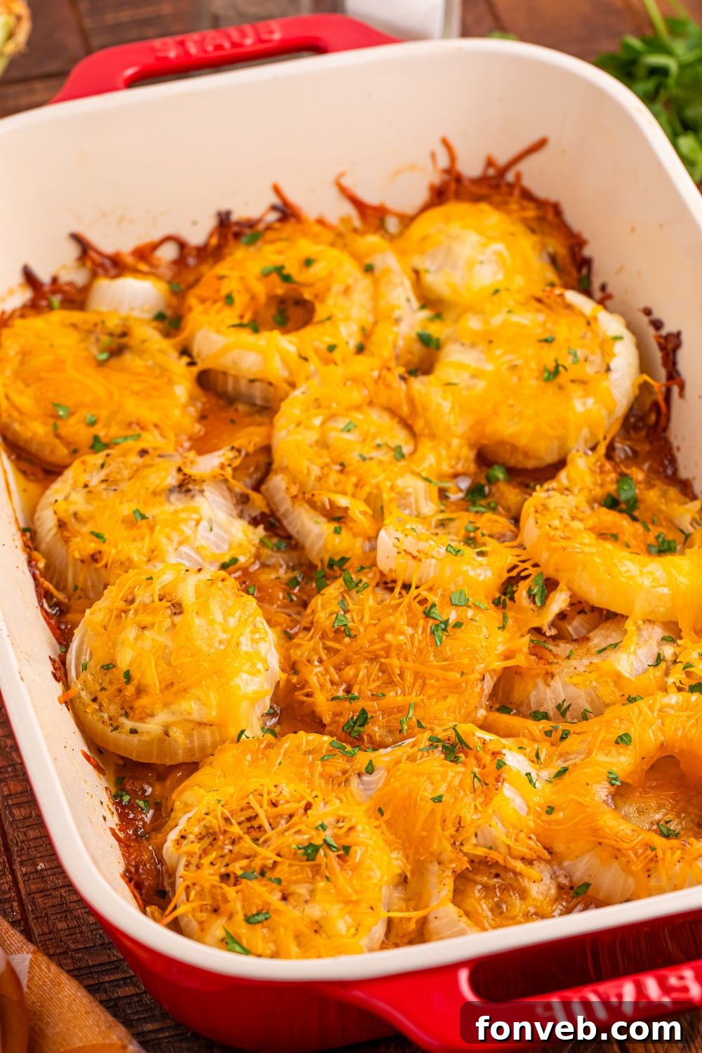 onion baked with cheese on top in a casserole dish 