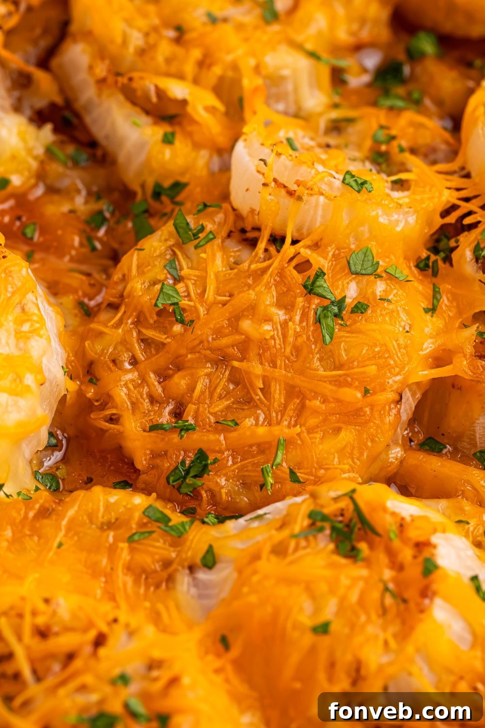 close up of Oven baked cheesy onions in pan