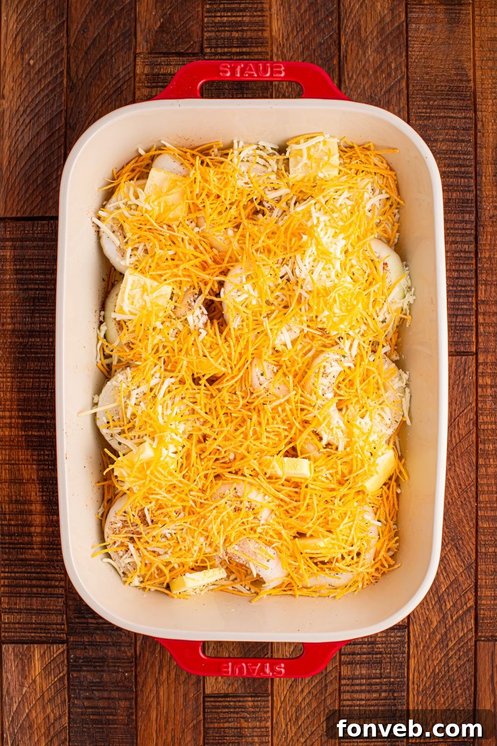 sliced onions and cheese sprinkled on top 