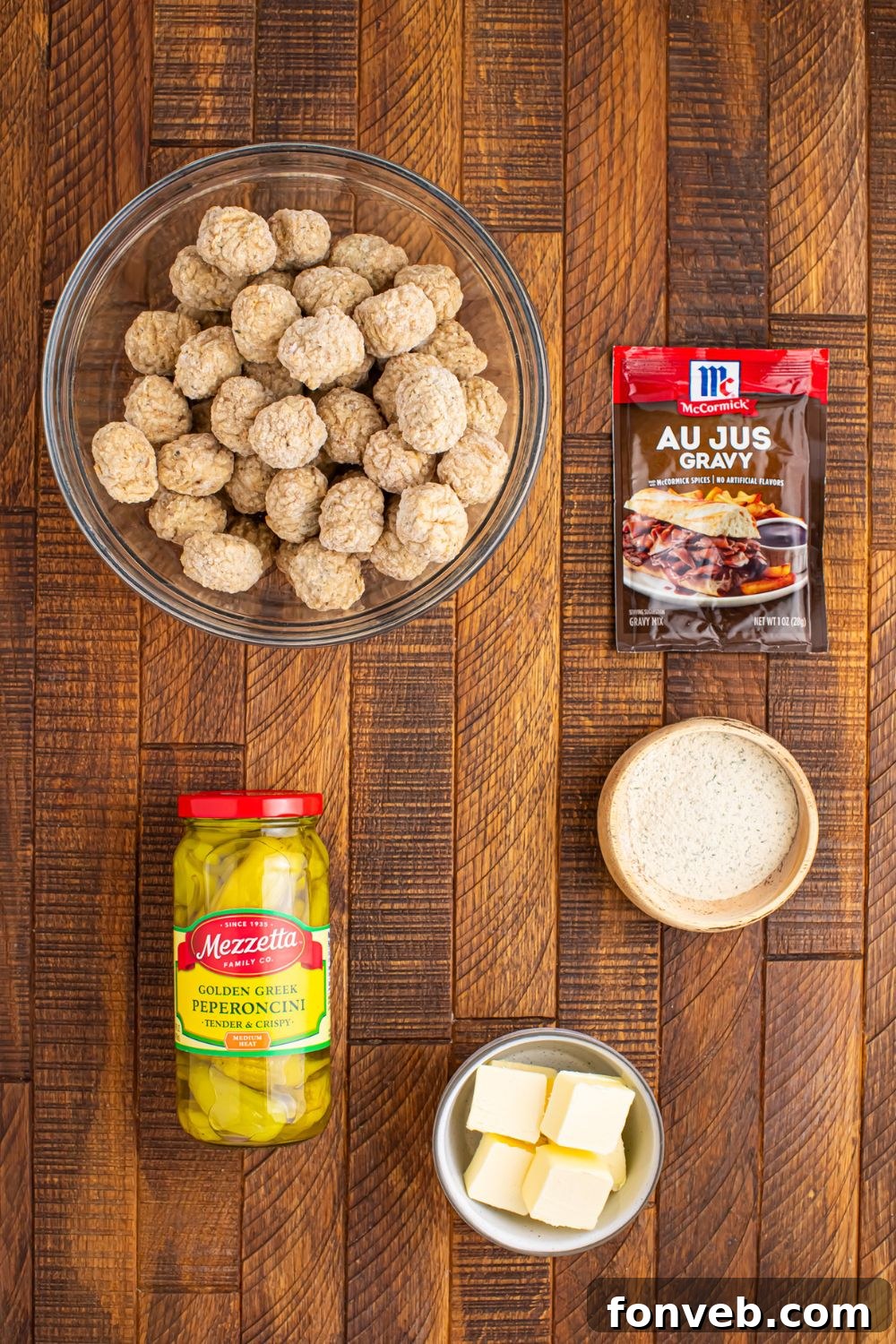 ingredients to make Crockpot Mississippi Meatballs sitting on table in single serve containers 