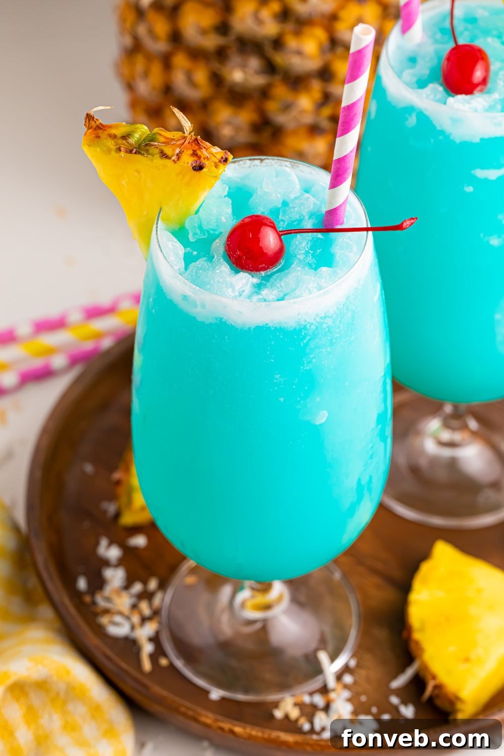 Frozen Blue Hawaiian Cocktails with a rimmed glass of sugar 