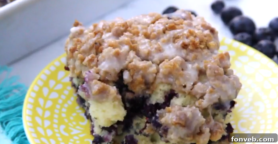 Blueberry Muffin Buckle Cake ready to be served, showcasing its golden-brown topping