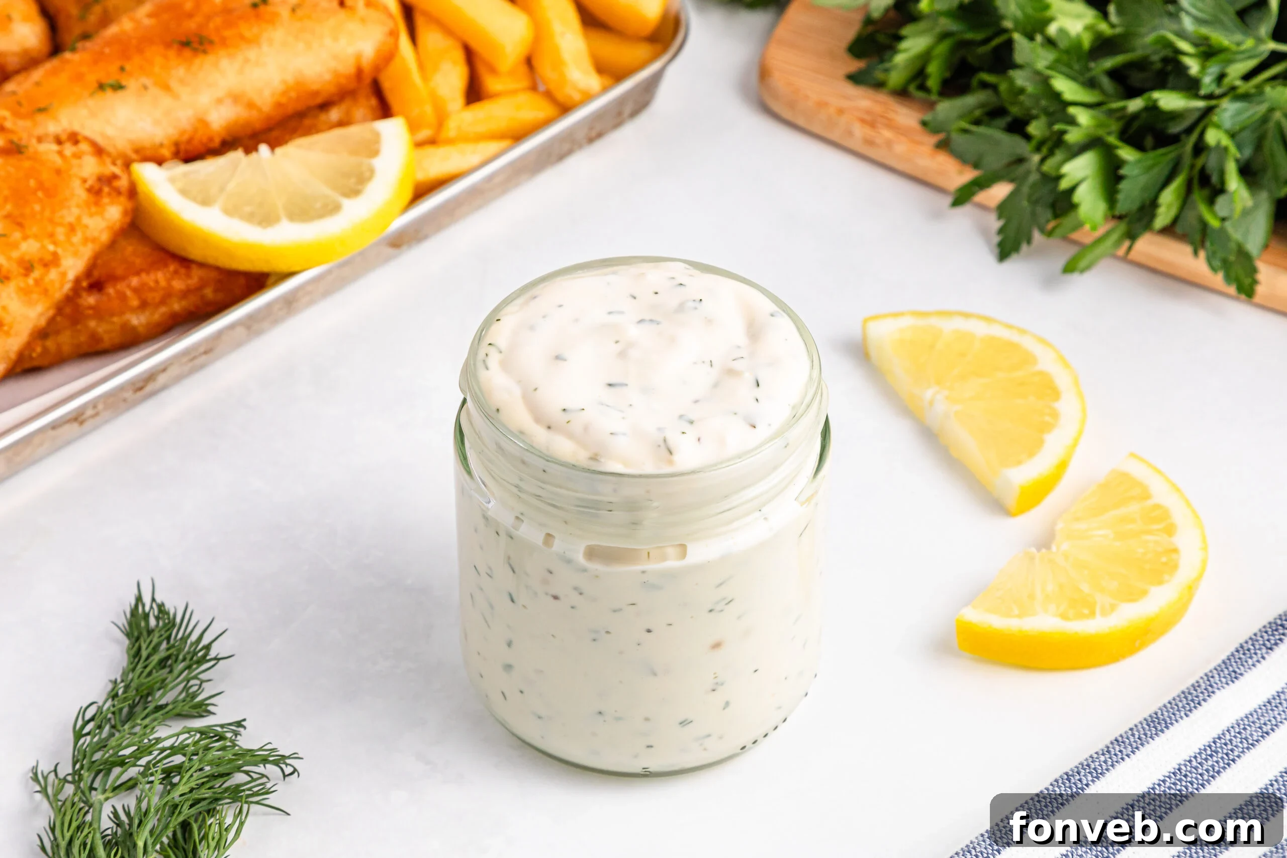 Effortless Homemade Tartar Sauce Beats Store Bought 4 Easy Homemade Tartar Sauce (Better Than Store-Bought!) elegantly displayed in a small glass jar, ready for serving.