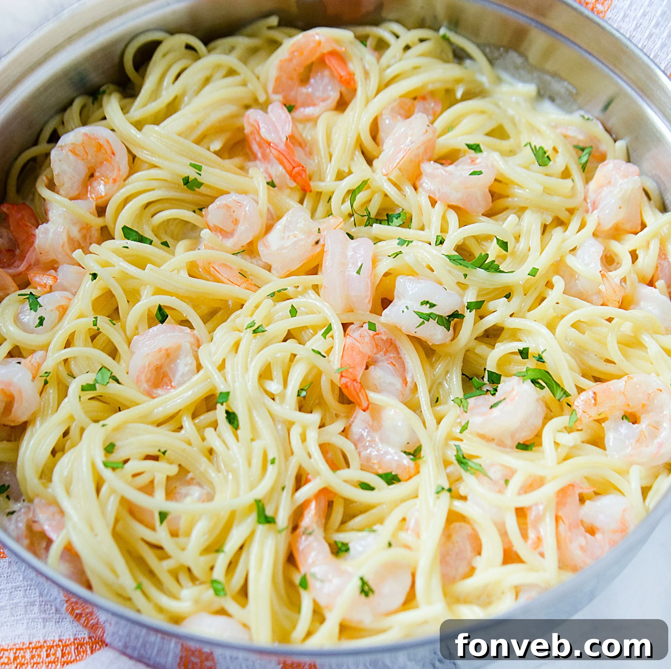 Delicious Four Cheese Garlic Shrimp Pasta served on a plate, ready to eat.