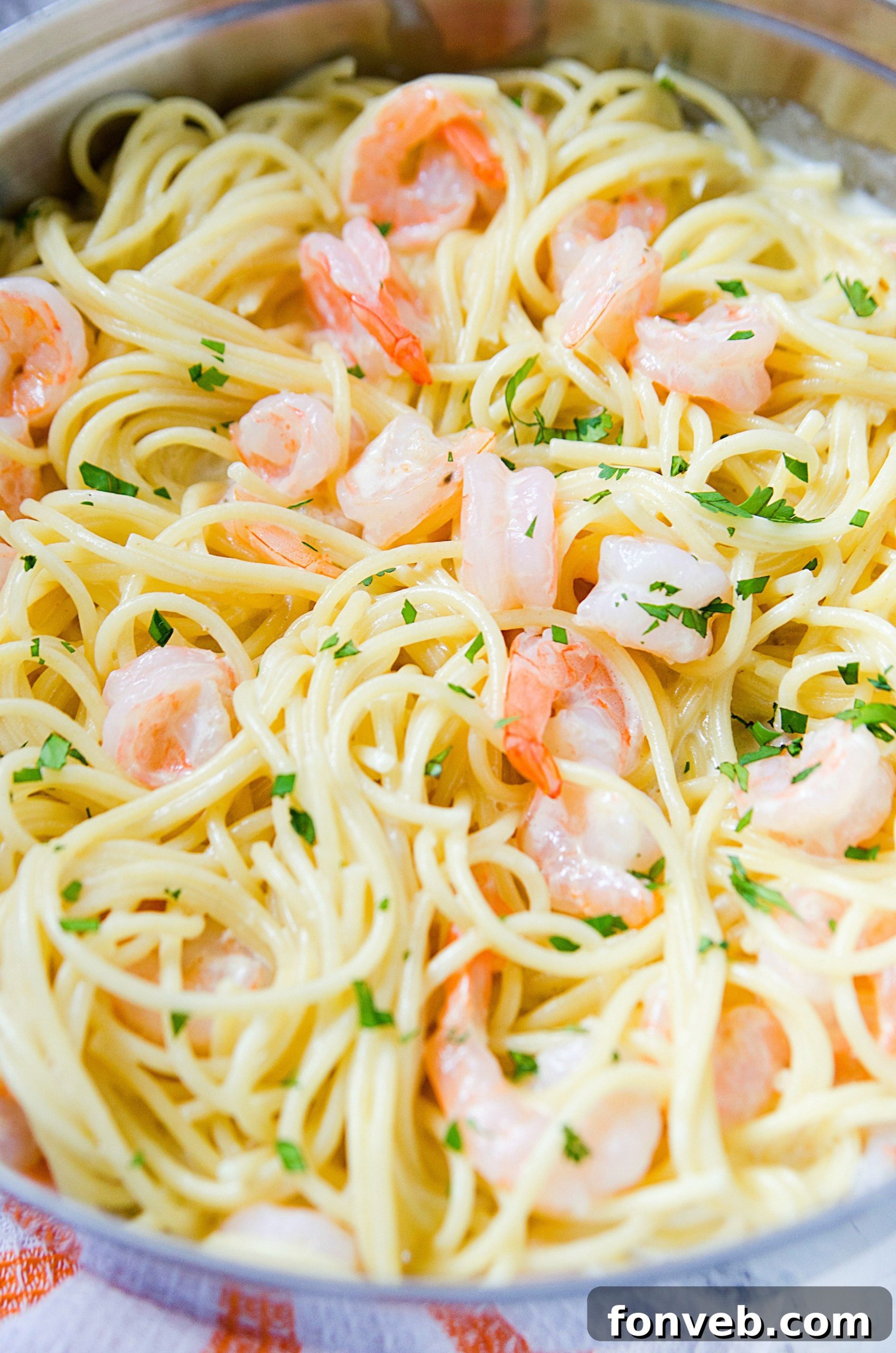 Detailed close-up of the Four Cheese Garlic Shrimp Pasta, highlighting the texture of the shrimp and spaghetti.