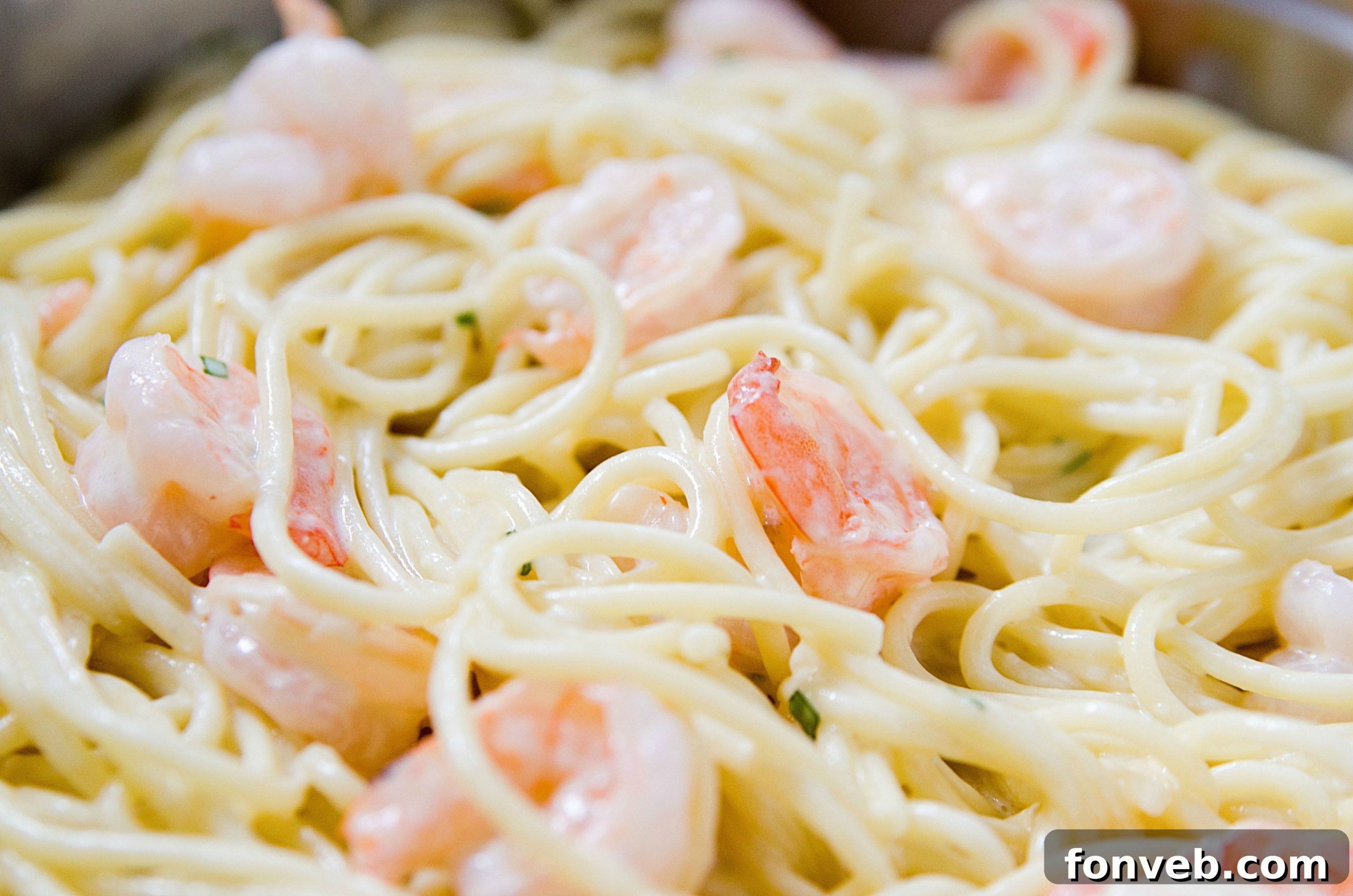 Large skillet filled with the creamy, cheesy Four Cheese Garlic Shrimp Pasta, ready to be served.