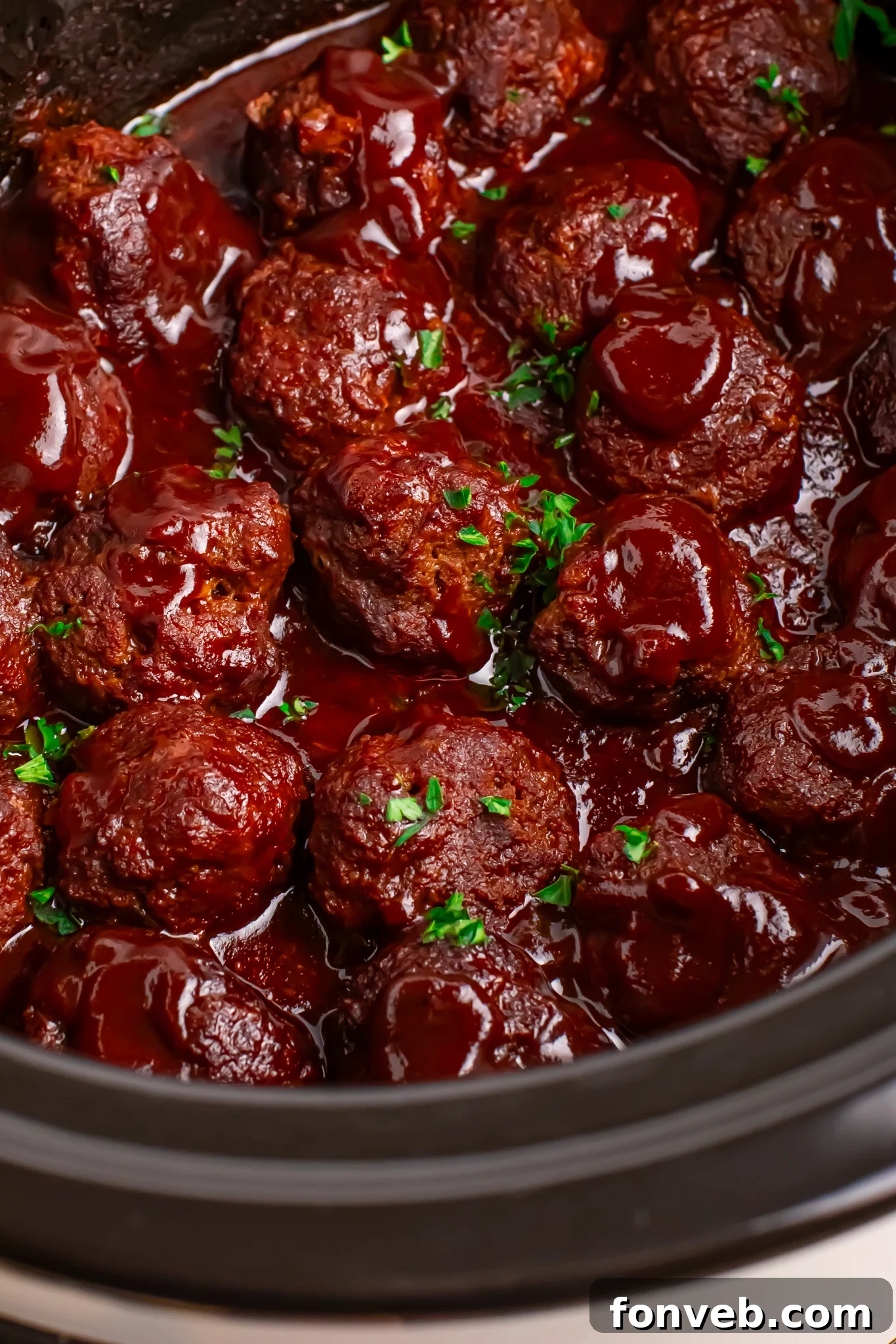 Crockpot Homemade BBQ Meatballs in a black slow cooker 