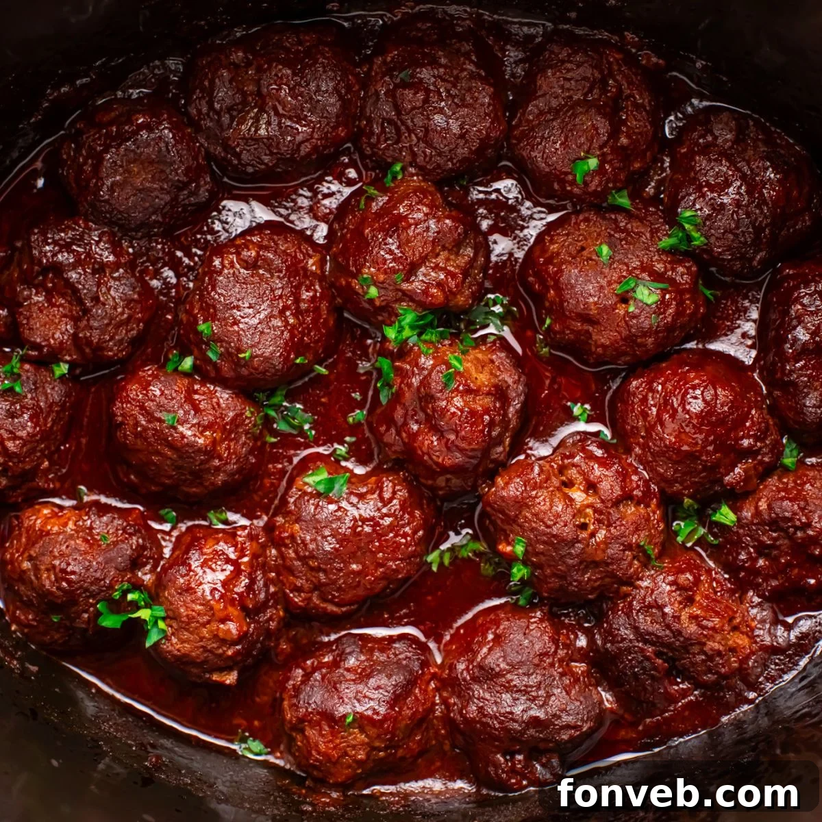 Crockpot Homemade BBQ Meatballs on table in a crockpot 