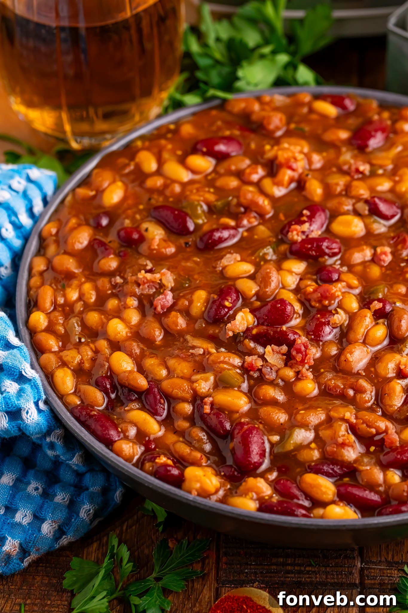 Crockpot bourbon baked beans in a large serving bowl 