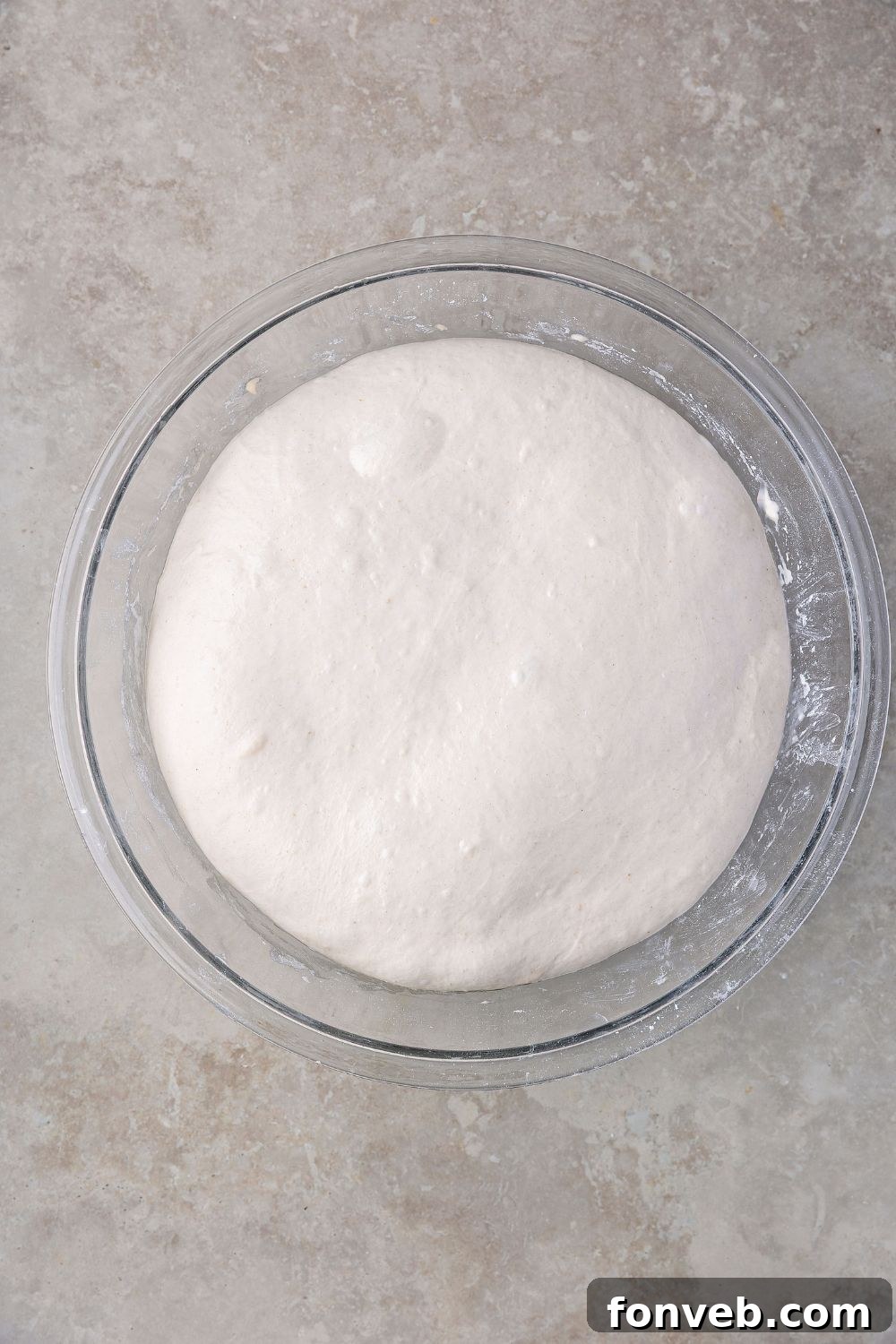 Effortless Homemade Sourdough Perfectly Crusty Always 13 Homemade Sourdough Bread dough risen in a glass bowl