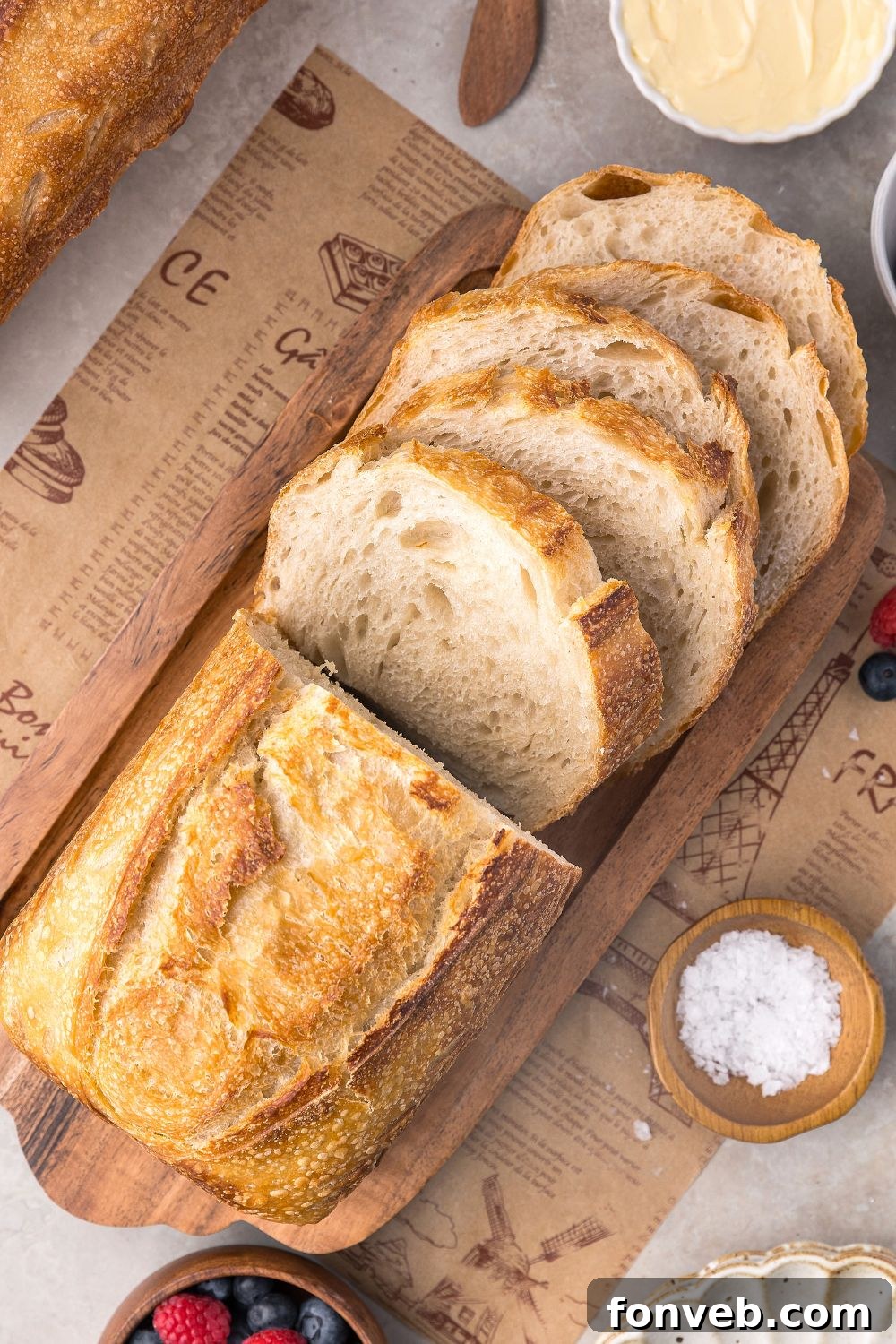 Effortless Homemade Sourdough Perfectly Crusty Always 25 Homemade Sourdough Bread sliced on tray with some butter and salt in small bowls to side