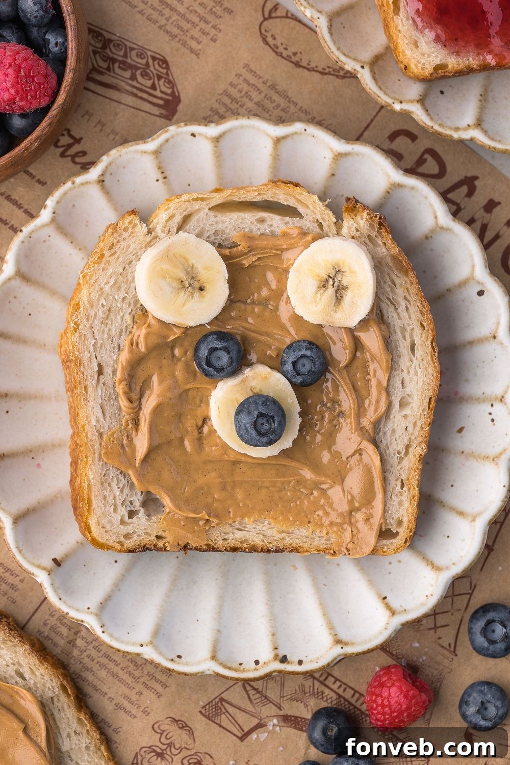 Effortless Homemade Sourdough Perfectly Crusty Always 29 sourdough bread decorated to look like a bear with peanut butter, bananas, and blueberries