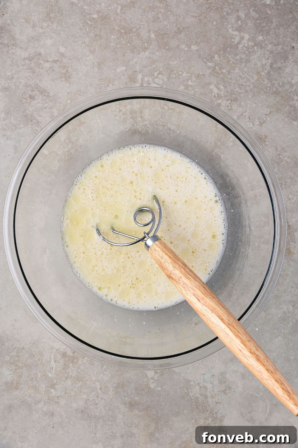 Effortless Homemade Sourdough Perfectly Crusty Always 8 wet ingredients in a bowl for making Homemade Sourdough Bread