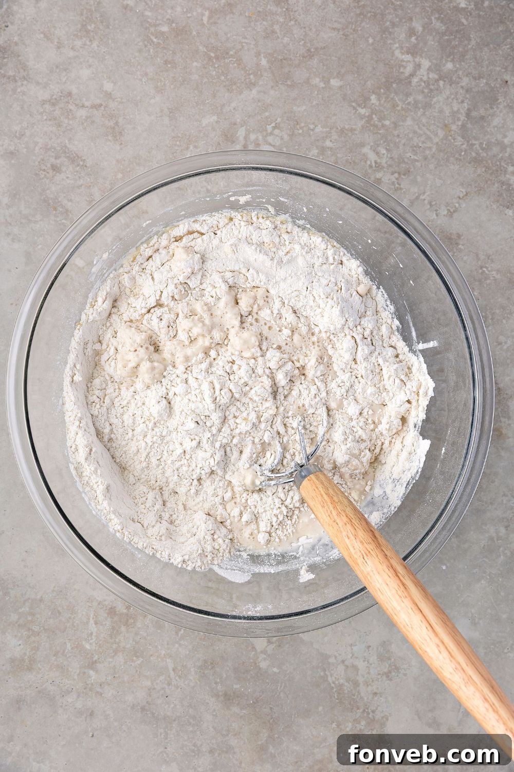 Effortless Homemade Sourdough Perfectly Crusty Always 9 dry ingredients for making Homemade Sourdough Bread in glass bowl on table