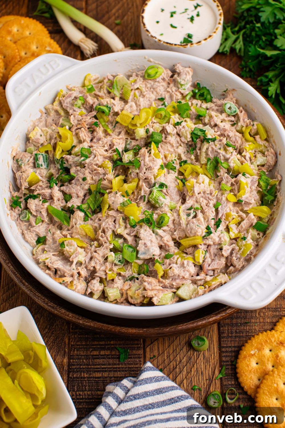 Pepperoncini Ranch Tuna Salad on table in a white bowl with some crackers to side for dipping 
