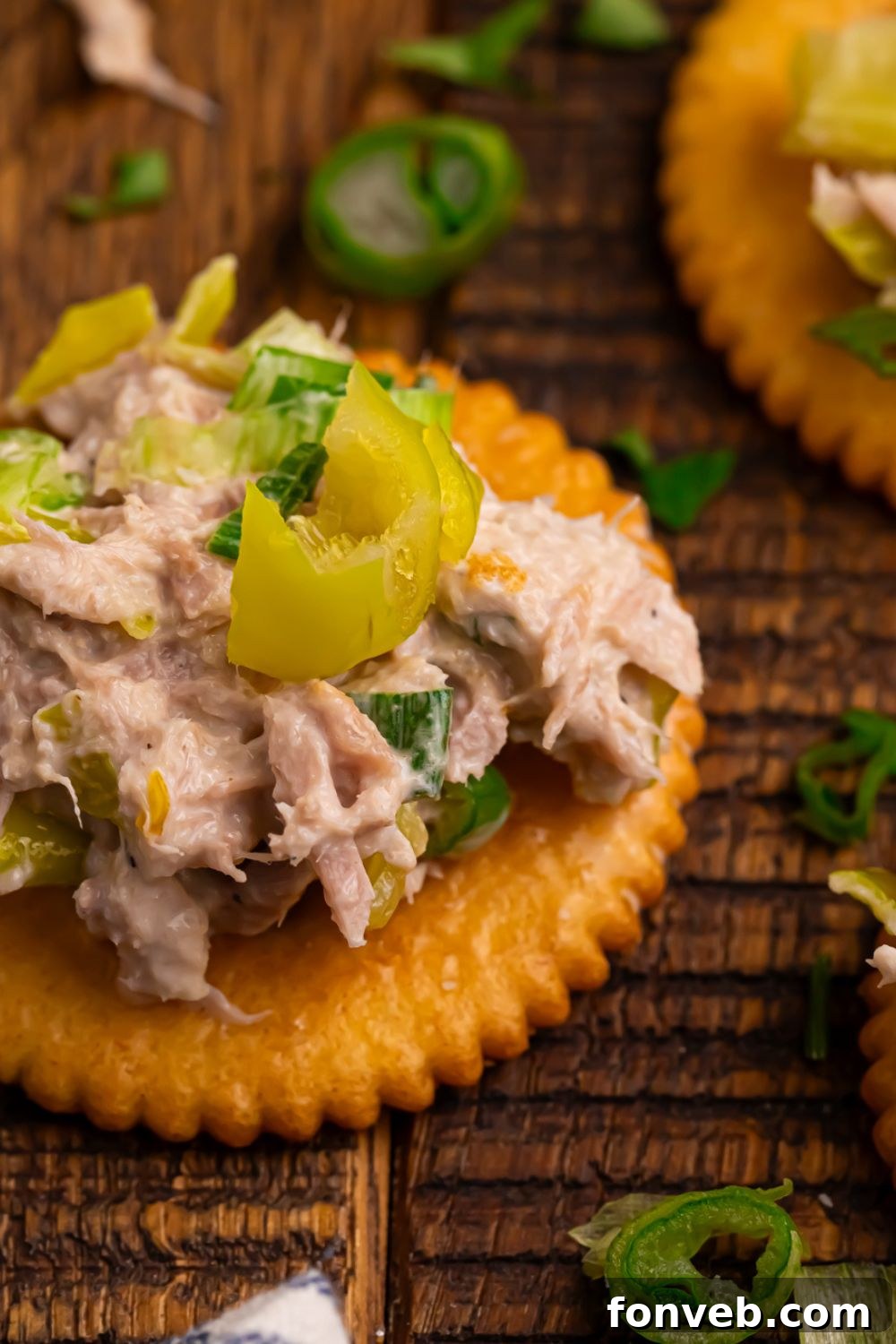Pepperoncini Ranch Tuna Salad on a cracker sitting on table 