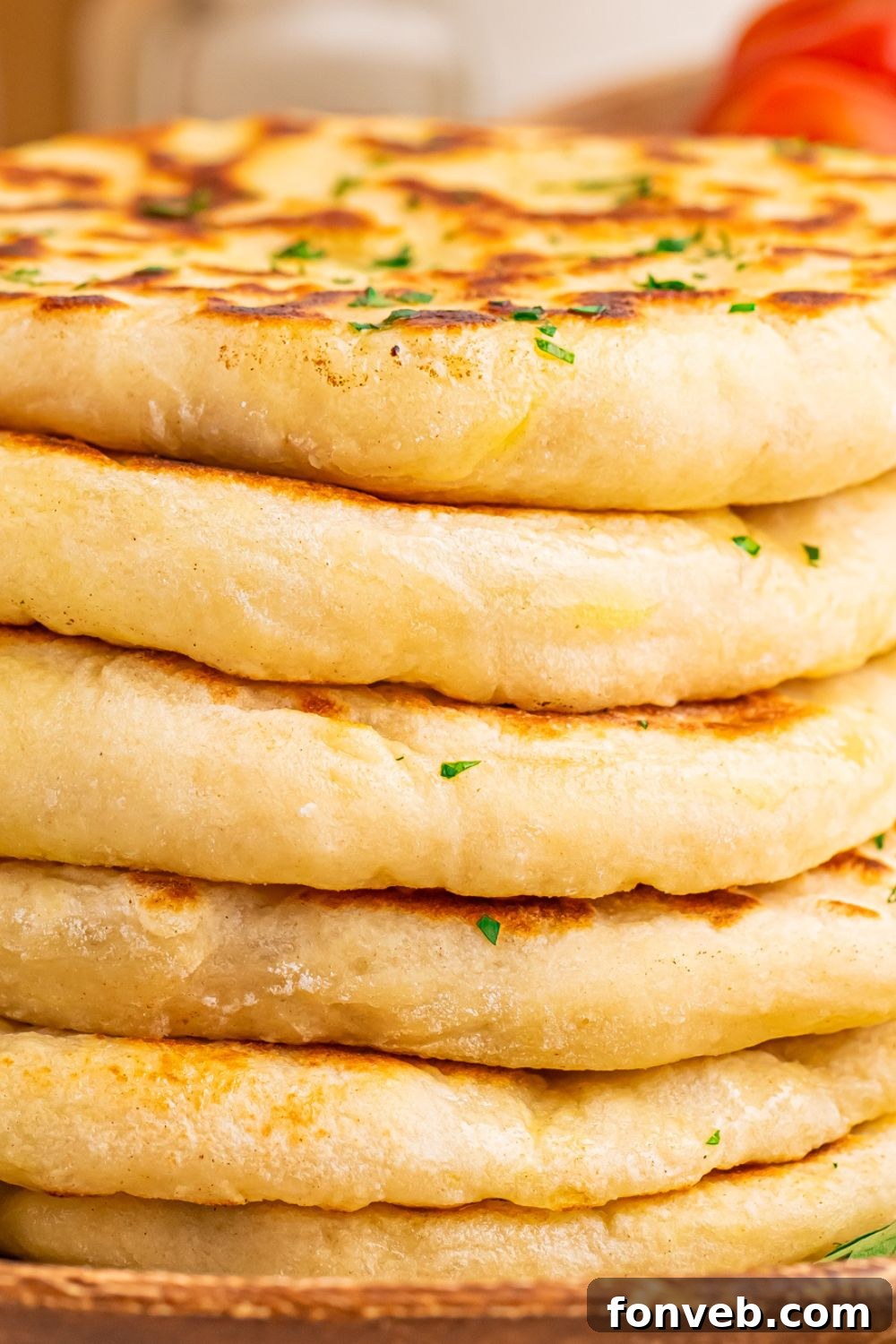 Close-up of a stack of fluffy 3-Ingredient Flatbreads, showcasing their thick and airy texture
