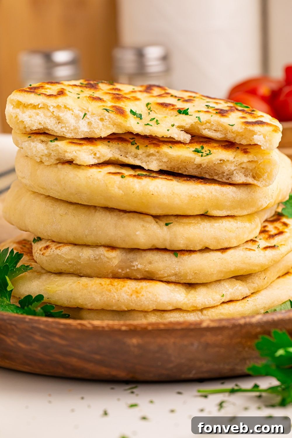 A tower of soft, thick 3-Ingredient Flatbreads, topped with fresh parsley
