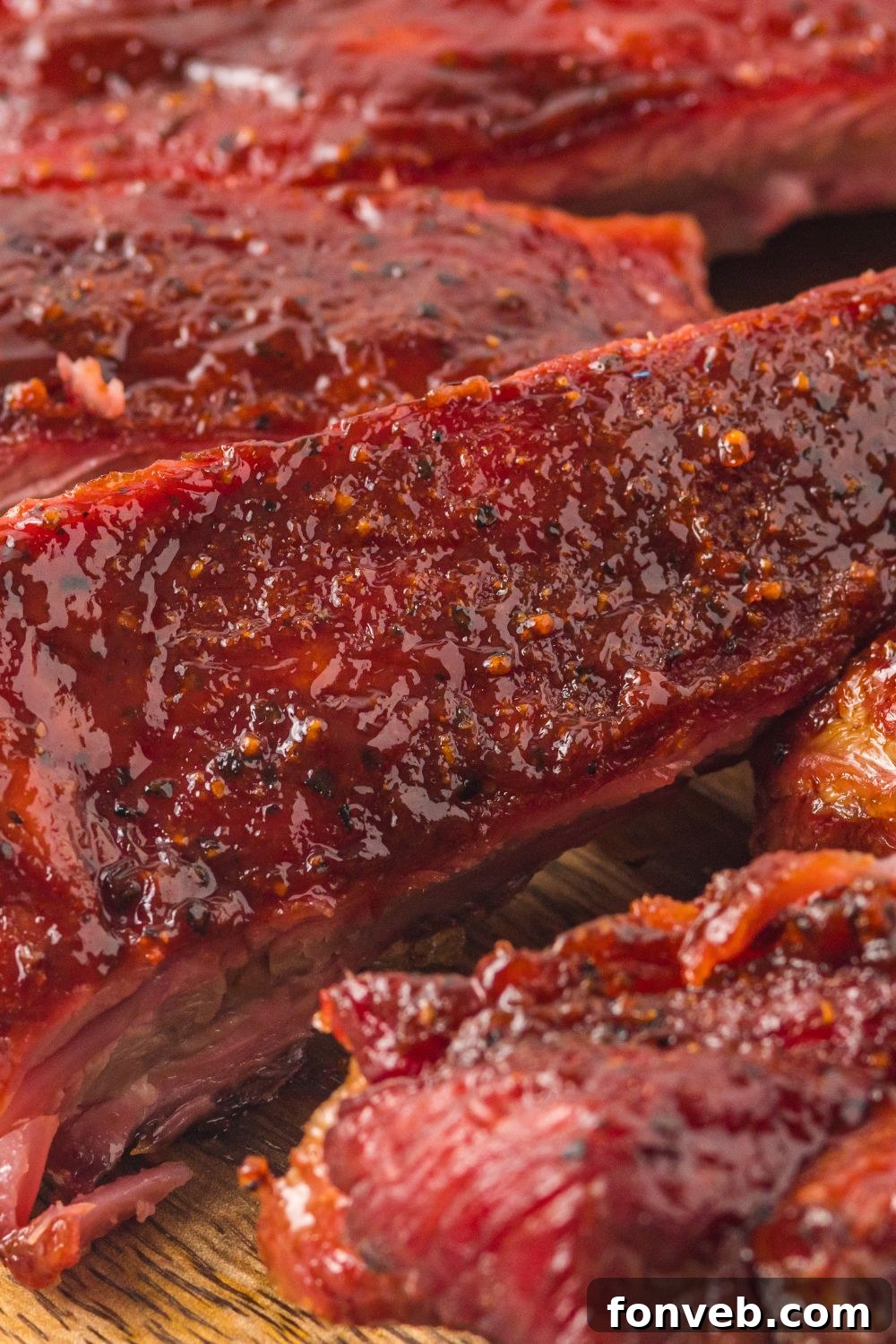 close up of Grilled BBQ Baby Back Ribs to show the sticky sauce